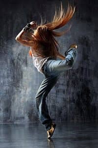modern style dancer posing behind studio background